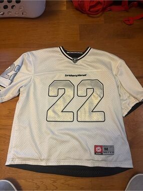 Black and white reversible broken planet jersey number 22